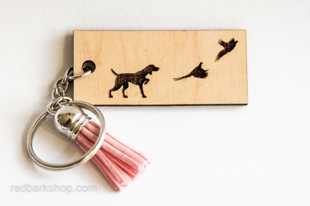 Pink tassel wood keychain with bird dog