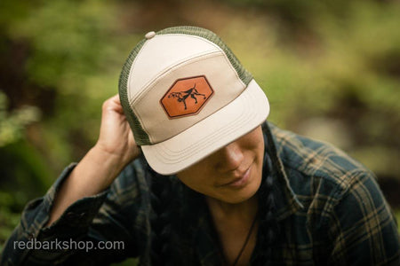 Woman wearing pointing dog hat with trucker mesh