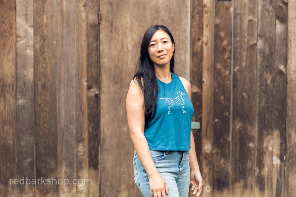 Asian woman wearing turquoise blue Dog design flowy crop tank top