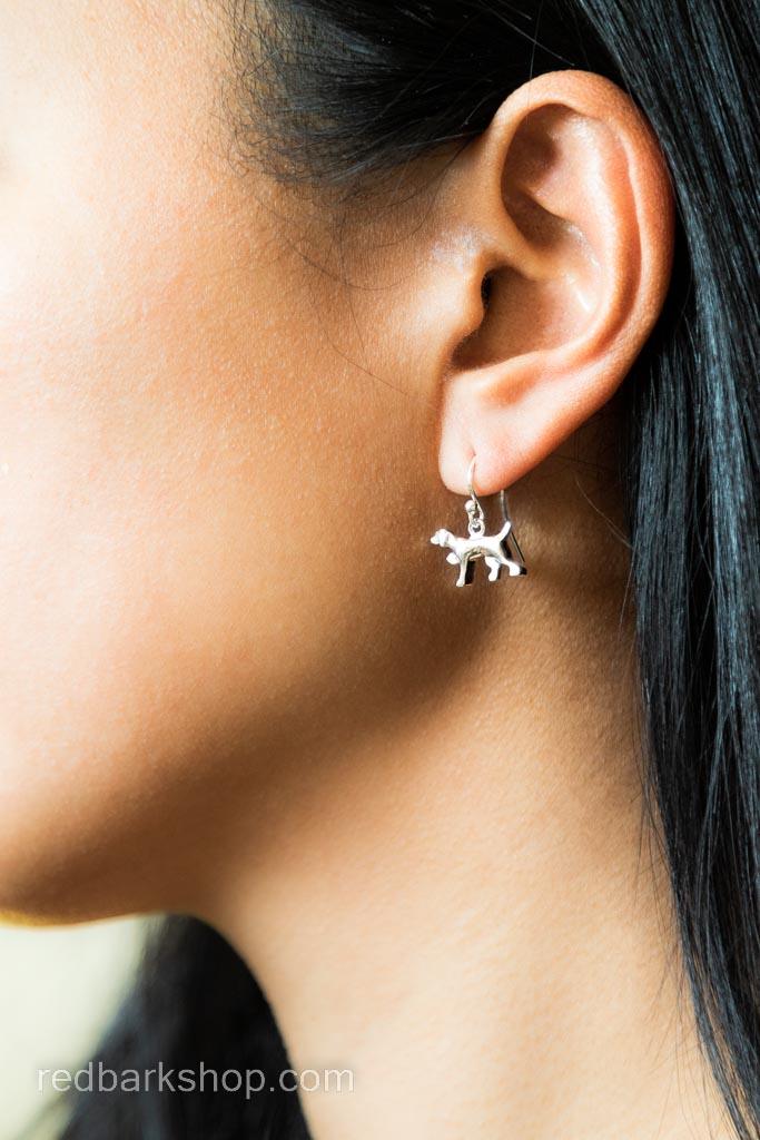 Dangle bird dog silver earrings modelled