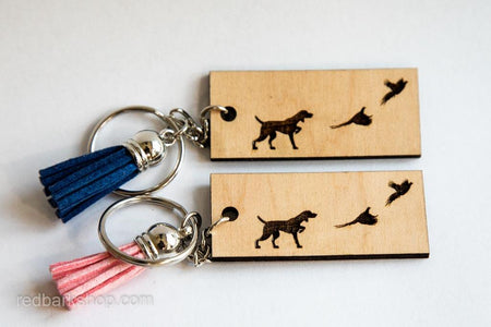 Pointer dog with birds in wooden keychain and blue and pink tassels