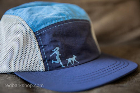 Running hat with girl chasing dog in navy and ocean blue and grey mesh