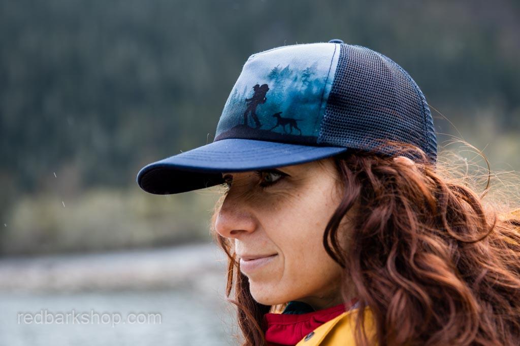 Side view of navy pnw hat with hiker and dog