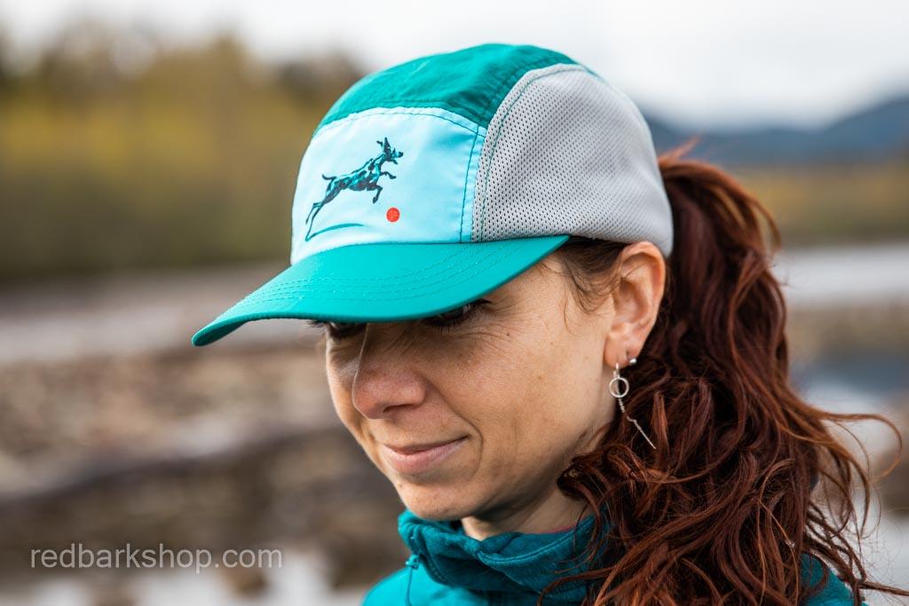 running hat in turquoise featuring a leaping dog