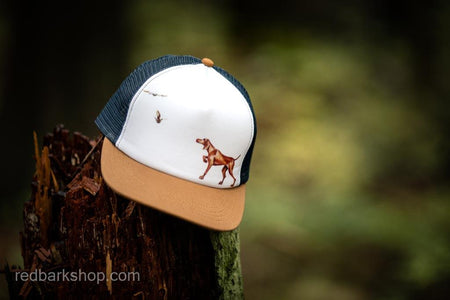 Red bird dog Vizsla hat with pointing dog and grouse navy mesh and brim