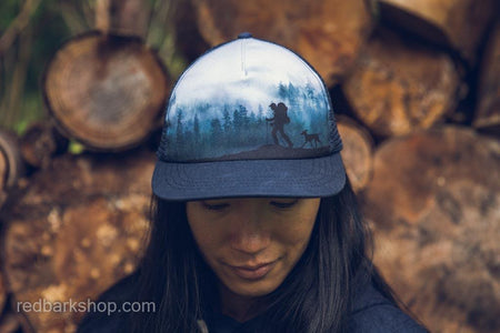 woman modelling hiker dog hat with misty cloudy forest