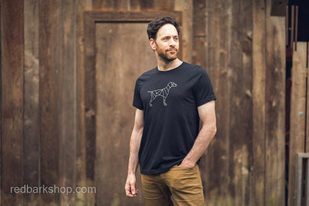 Side view of Man wearing black Tshirt featuring geometric simple dog design
