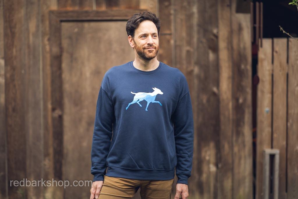 Smiling Man modelling Mountain Dog Sweatshirt in Navy