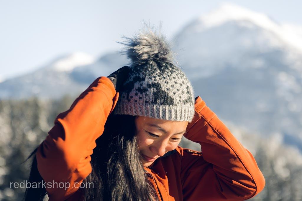 Asian Woman wearing Hand-knitted grey and black pointer dog beanies and toque with pompom