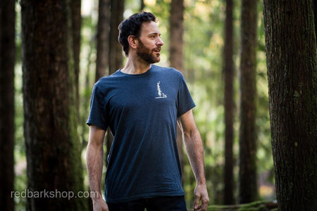 Man in forest in navy tshirt for trail and adventure dog lovers